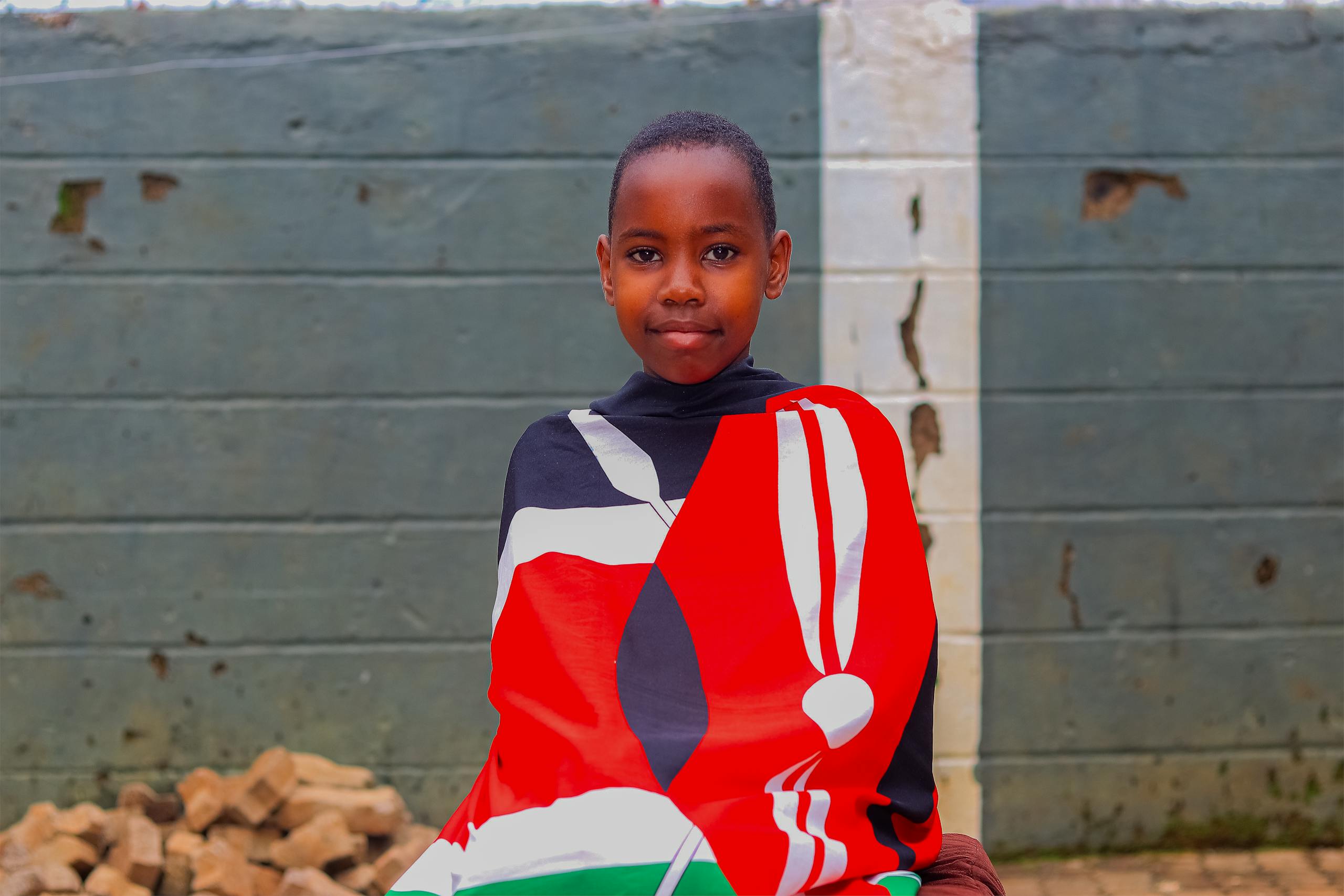 Young Kenyan Girl Covered in the Kenyan Flag